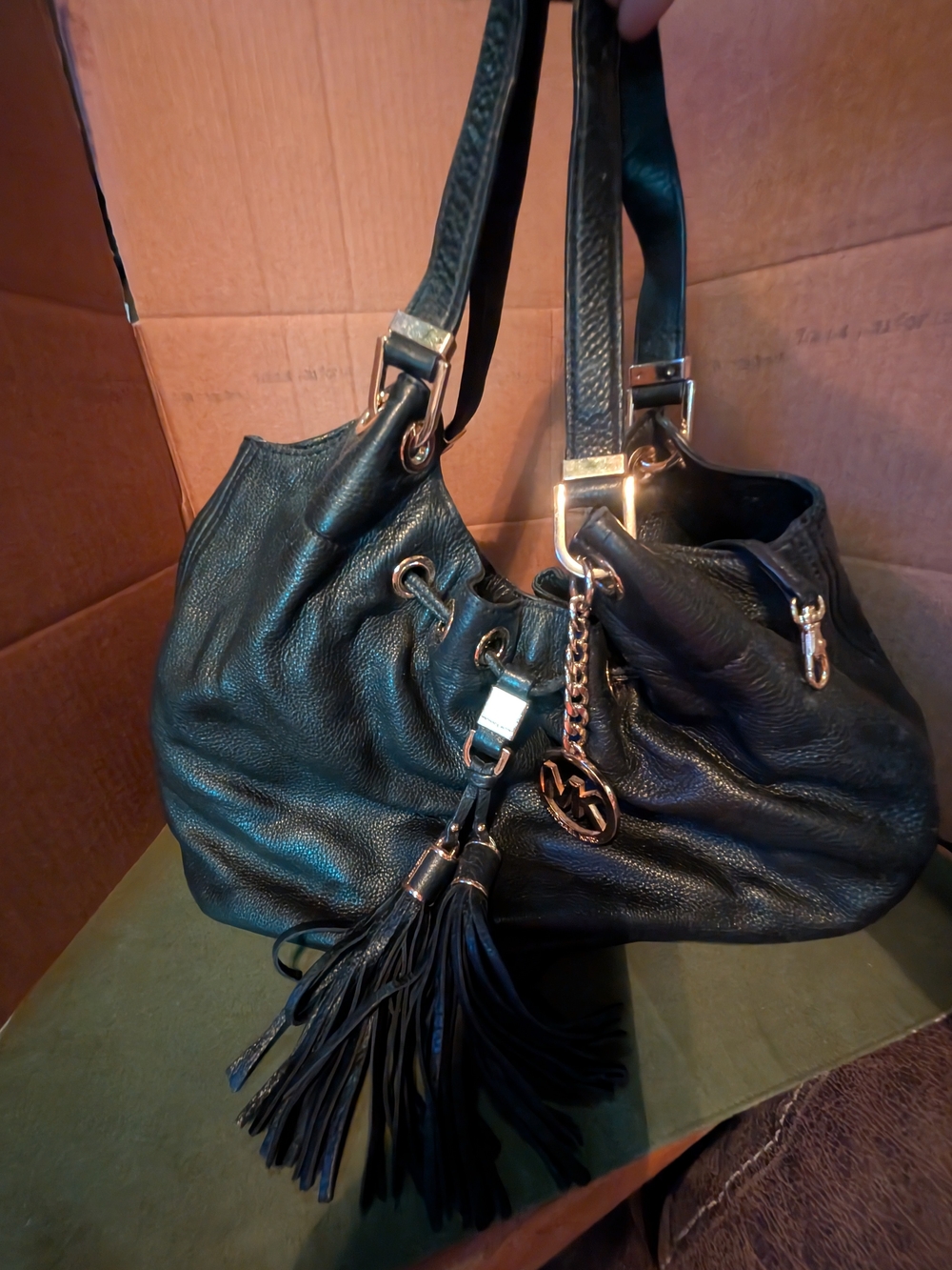 Michael Kors Black Leather Shoulder Bag with Gold Hardware and Tassel